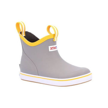 A youth-sized XTRATUF ankle deck boot in gray with yellow accents and the XTRATUF logo visible on the side.